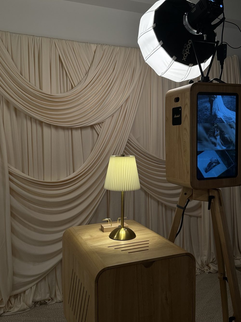 La Memorya booth with ivory drape styling